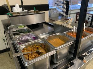 Sauce, condiments and soup station. at Taj Chaat House in Irving