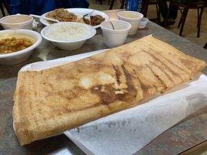 Plain Dosa. Crispy, hot from the grill. Tastes like cheezy bread to me. Yum! at Taj Chaat House in Irving