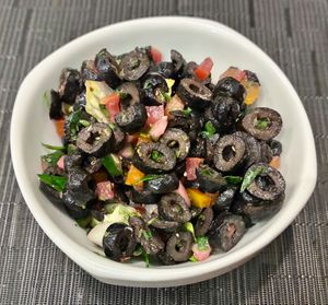 Black olive salad  at The Talk Restaurant in Dubai