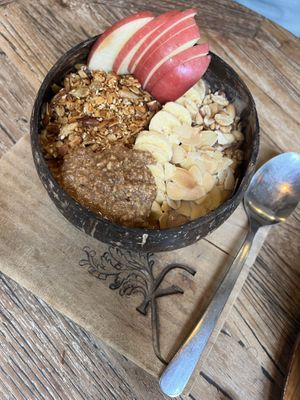 Choco Peanut Bowl - banana, coconut cream, raw cacao, peanut butter, topped with banana, apple, almond, peanut, cacao nips & granola  at Kayu Cafe in 