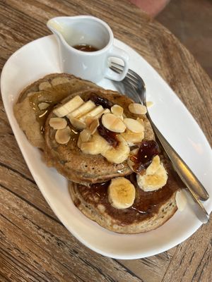 Fluffy Pancake - Banana & cinnamon pancake topped with banana, date, almond, maple on the side  at Kayu Cafe in 
