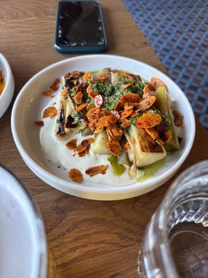 Grilled leeks with almond sauce & almonds  at Root Bath in Bath