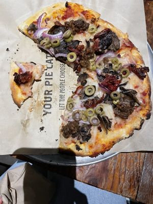 Pizza with vegan cheese and sausage .  at Your Pie in Savannah