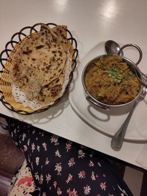 Brinzal bharta (mushed eggplant dish) and alu piaz paratha (wheat bread with onion and potato), both good at Saravana 娑羅婆納 in Kowloon