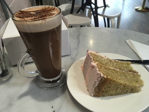 Pistachio cake and hot chocolate. This hot chocolate is the best I've ever had! at Ruby's of London in South East London