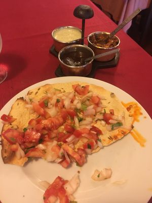 Masala Papadum—a crispy lentil bread with fresh tomatoes, onions, and herbs at Sitar in Rome
