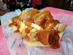 Delicious curry wurst! Perfectly cooked fries too. at Beelzebab in Brighton