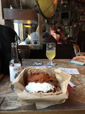 Amazing spicy coated seitan wholemeal pita with loads of veggies and tzatzikiiii💚 at Beelzebab in Brighton