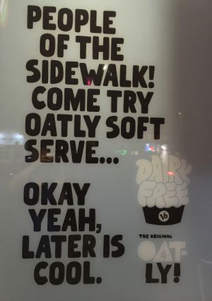 Sign outside for vegan Oat-ly yogurt at 16 Handles - Upper East Side in New York City