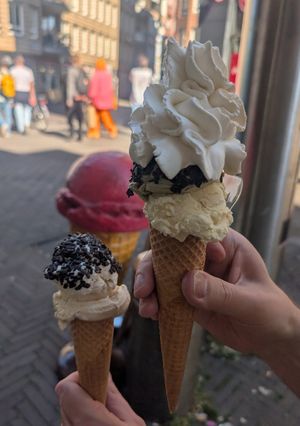 Tompouce, pistache with whipped cream and choco dip and malaga, straciatella with choco dip at Scoops in The Hague