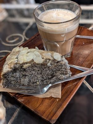 Cappuccino with oat milk and lemon poppy seeds cake at TumaBe – Coffee and Comfort in Berlin