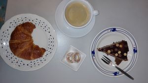 Coffee and vegan cake and croissant at VegaVerso in Leuven