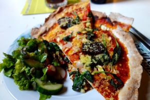 Vegan pizza with Wilmerburger 'cheese' at Autonoom Centrum in The Hague