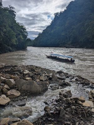 Taking a boat ride in the river of the Amazon of Peru at Unruly Travel Group Trips - Berlin in Berlin