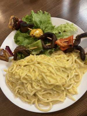 Tallarin a la Hauncaina con Anticuchos (Pasta in Huancaina/cashew Sauce)  at Tallarin Verde Peruvian Restaurant in Blairsville