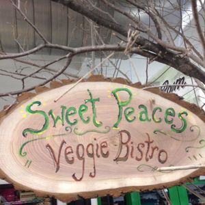 Sign in the east wing of Flint Farmers Market at Sweet Peaces in Flint