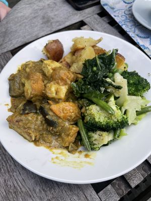 Tofu and coconut curry with green veg and roast potatoes   at Vaults and Garden in Oxford