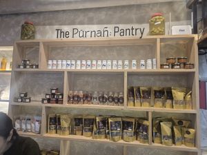 Purnah pantry at Pūrnah: Kitchen. Pantry. Table in Mumbai