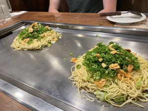 Vegan okonomiyaki served hot on the grill. at Nagataya in Hiroshima