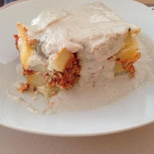 potato casserole with sunflower seeds cream souce at Vega City in Budapest