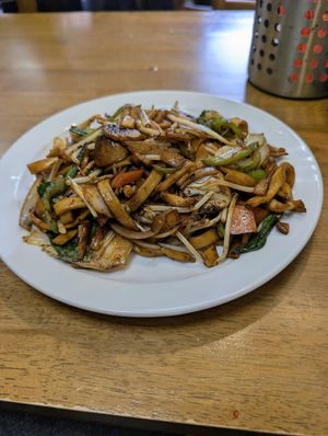 Stir-fried vegetables with handmade spicy noodles at Soya Express in Sheffield