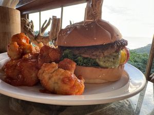  Plant based burger w/ cauliflower wings and french fries  at El Avion in Manuel Antonio