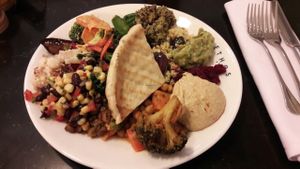 Trying to fit all the different vegan dishes into one plate at Ethos in London