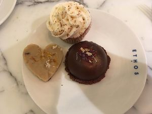 Vegan cupcake, chocolate bomb, peanut butter cup at Ethos in London
