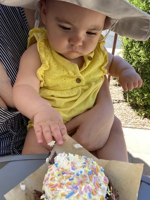My little checking out the vegan cupcake she picked out!  at Urban Cookies Bakeshop in Phoenix