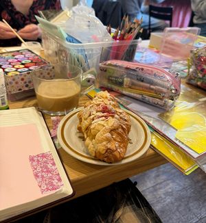 Raspberry croissant and oat latte  at Bee May Bakery in Brighton