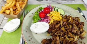Pita (seitan and oyster mushroom) with very nice and crispy Belgian fries, garlic sauce and veganaise at Mykene in Leuven