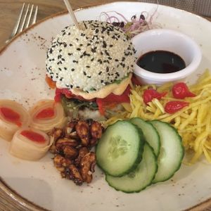 vegan sushi burger with wakame, kimchi mayonnaise, kimchi rolls, cashews etc. at Mykene in Leuven