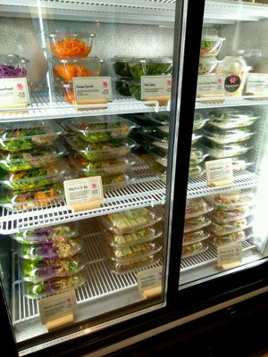 Fridge with plastic containers  at Tanya's Cafe in South West London
