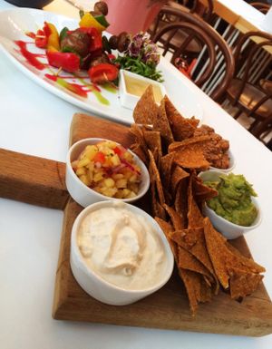 Vegan raw nachos with salsa, cashew nut cream cheeze, mushroom and walnut meat & raw kebabs  at Tanya's Cafe in South West London
