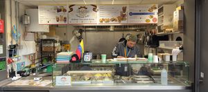 Juan serving another happy customer at Arepita in Derby