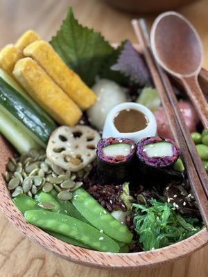 Japanese macrobiotic bowl. I like it has black rice, asian ingredients, and sea plants in it. Wish to have bigger tofu portion but the sauce was pretty nice and well harmonized.  at Roots Plant-based Cafe - Hẻm 41 Xuan Thuy in Ho Chi Minh City