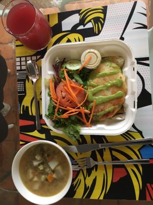 Daily special - vegetable soup, enyucado and cas/rosa de jamaica drink with side salad with cas dressing. Ordered for take out. Delicious. at Mantras - San Pedro in San Pedro