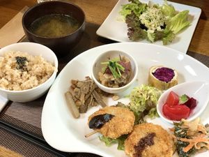 fried wheat gulten bread, rolled fried tofu with purple cabbage, Shimeji mushrooms with grated radish, Braised burdock with miso, Marinated beets and tomatoes , etc  at Vege Cafe Lotus in Toyohashi