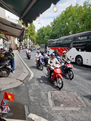 next to a busy canal road at Bánh Mì Chay Tốt - 1315 Hoàng Sa in Ho Chi Minh City