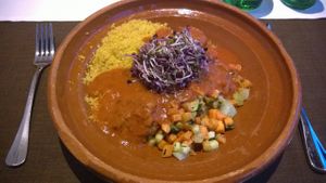 Vegan tajin: saffron couscous, falafel, vegetables and spicy tomato sauce at Cammerlander Market Bar in Innsbruck