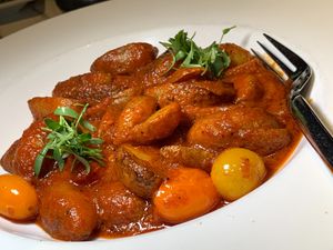 Patatas Bravas: CCA Fingerling Potatoes, San Marzanas Tomatoes, Black Garlic Powder. (Kalamazoo Vegan Chef Challenge 5/26) at WL Social House in Kalamazoo