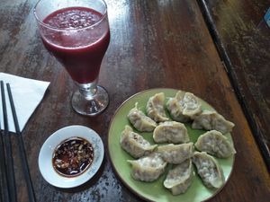Vegan dumplings and beetroot ginger drink. at Mood Food Energy Cafe in Yangshuo