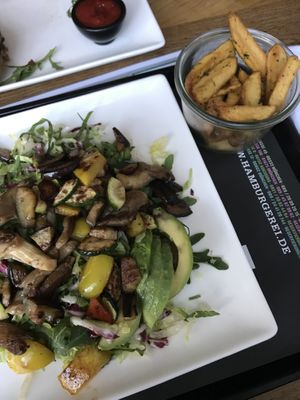 Acapulco salad with grilled veggies and avocado on a bed of romaine -- a bit oily, but still really delicious. Accompanied by truffle fries (unclear if they are definitely vegan). at Hamburgerei in Munich