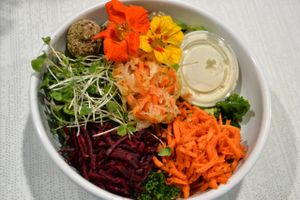 Our Buddha Bowl is one of our mainstays. It has 3 Falafel Balls, shredded Beets, Carrots, Avocado & Curtido from Fermenti Artisan on top of Honey Spiced Kale. The Kale can be switched out to be made Vegan. Just mention it & Ezra's will happily comply at Ezra's Enlightened Cafe in Indianapolis