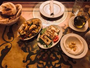 Spicy potatoes, grilled halloumi and hummus at Taboula in Cairo