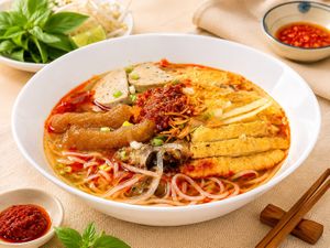 Saté Pho: Tofu, fresh tofu skin, vegan sausage, and shiitake mushrooms in spicy herbal pho broth at Luong-Loi Restaurant in Wheaton