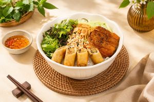 Fresh rice noodle with crispy rolls and vegan ribs and fresh veggies at Luong-Loi Restaurant in Wheaton