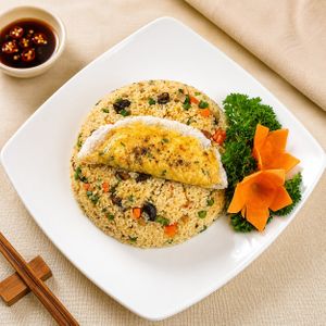 Half-Moon Tofu Fried Rice: Fried rice with vegan sausage, vegetables, and crispy half-moon tofu wrapped in rice paper at Luong-Loi Restaurant in Wheaton