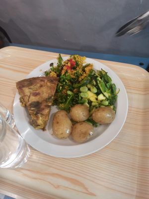 Vegan savoury flan, new potatoes and salads at Rainbows End Cafe in Glastonbury