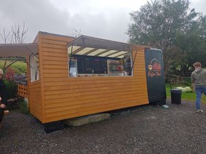 Cafe front with seating at Carrauntoohil Coffee Hut  in Killorglin